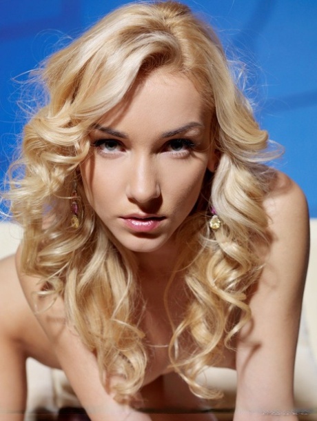 Teen solo girl Nataly F sports curly blonde hair while hitting upon sexy poses 84779102