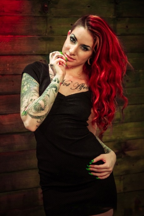 Tattooed redhead is tied up and penetrated with dildos by lesbians 80671757