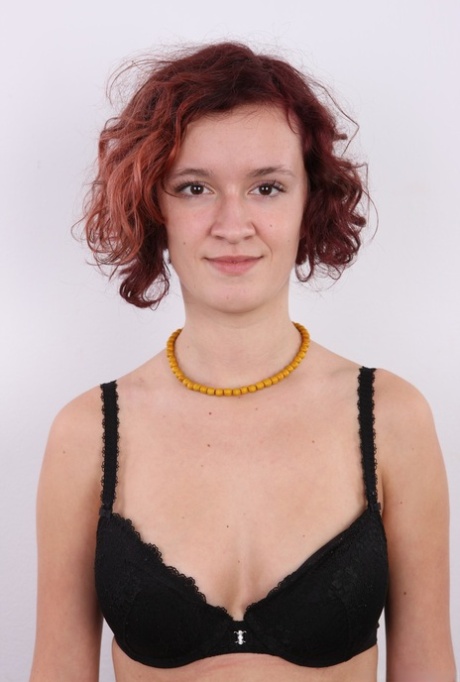Redhead teen Tereza stands in her clothes and boots before getting bare naked 12426264