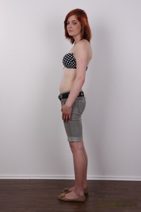 Amateur redhead Marcela bares her tiny tits before showing meaty labia lips 22083446