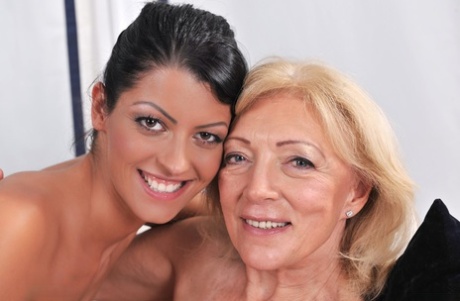Old and young lesbians Vivien Bell & Szuzanne appease horny twats on a sofa 40086853