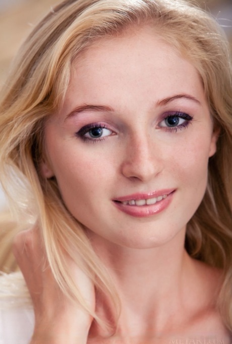 Petite blonde teen Leona Honey confidently displays her bald pussy on a chair 76852092