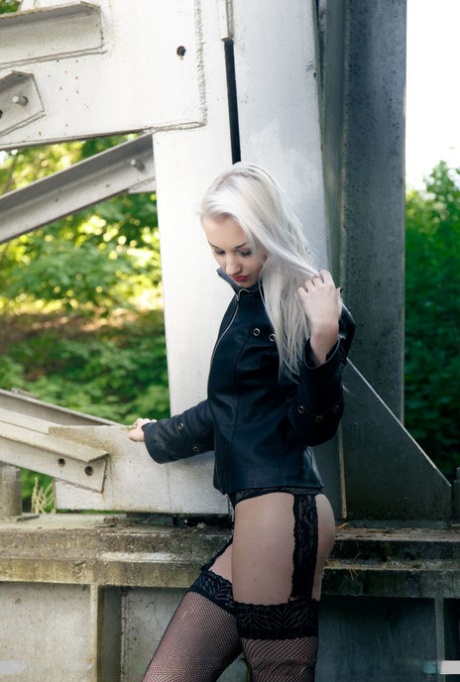 European teen Adelina White takes a pee on trestle bridge in black stockings 78894937