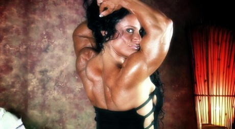 Dark-haired bodybuilder Debbie Bramwell flexes her muscles during a SFW gig 32639324