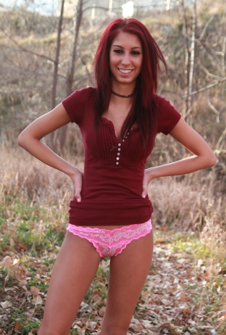 Amateur chick with red hair strips naked in a remote country region 63057809
