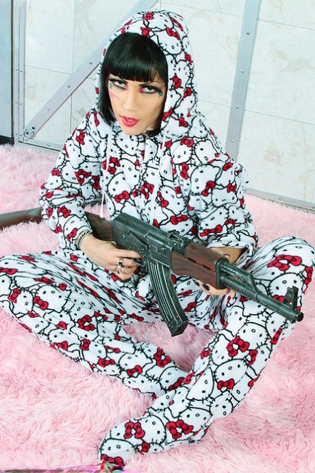 Goth girl Asphyxia Noir wields an automatic rifle while going nude 67248723