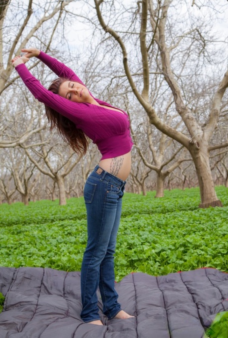 Aubrey Chase takes her purple sweater off and shows her big boobs in the park 56241278
