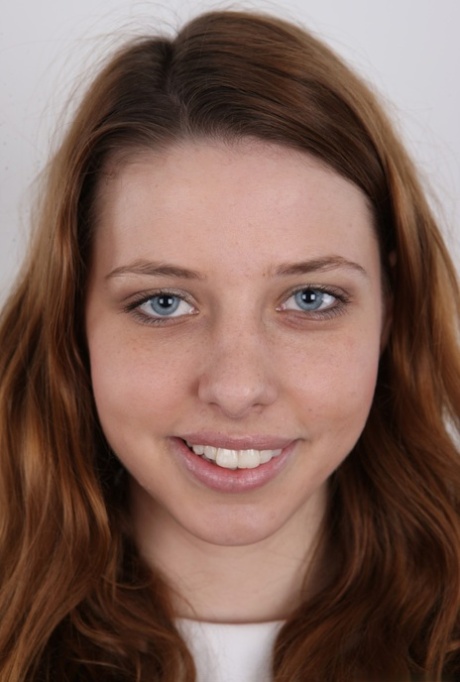 Redhead teen Tereza sits after undressing and standing naked 70286938