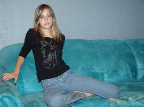 Young white girl uncovers her small boobs before taking off faded jeans 35859367