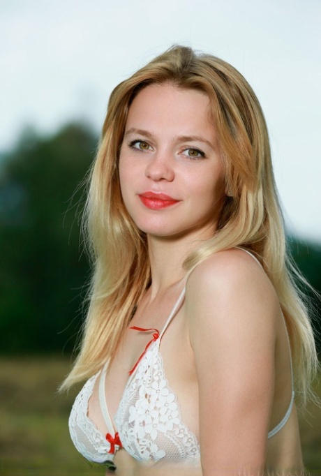 Teen model Elisa Liv wears lipsticks while getting naked on a blanket in field 64124098