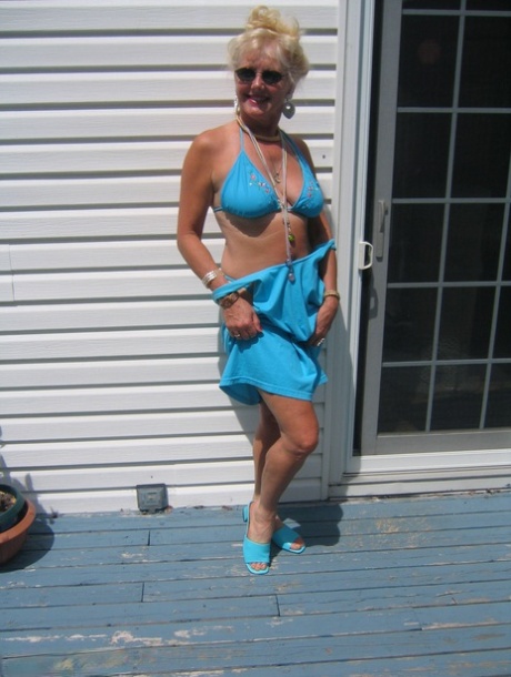 Mature blonde Ruth frees her tits and ass from a bikini in sunglasses 70377348