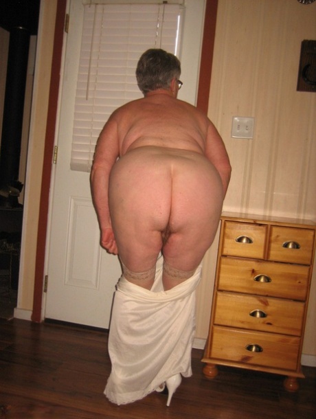 Fat nan Girdle Goddess shows her hairy armpits before revealing her saggy tits 11324459