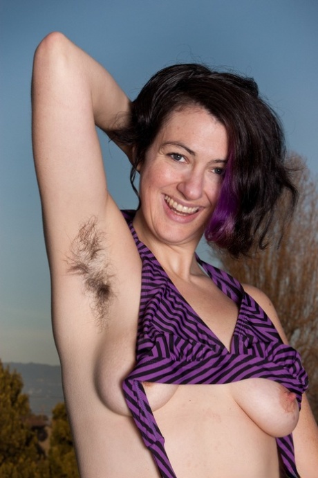 Brunette model proudly displays her hairy underarms and bush as she strips 66659277