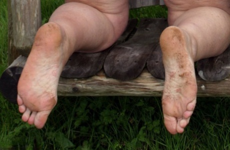 Old British woman Grandma Libby exposes her boobs on a backyard bench swing 36504926