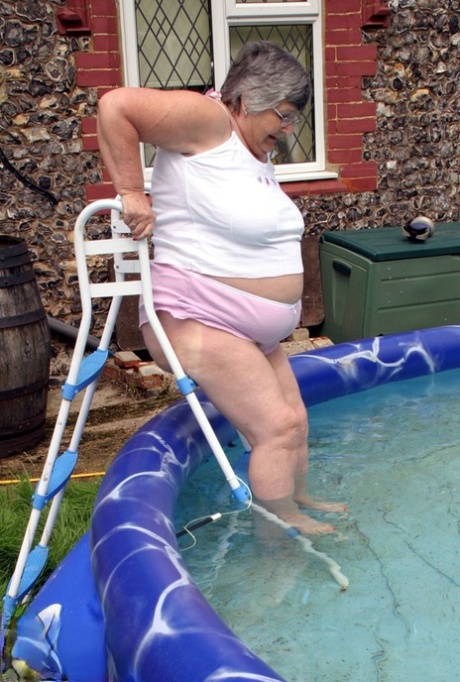 Overweight UK nan Grandma Libby exposes her boobs in a backyard swimming pool 60004597