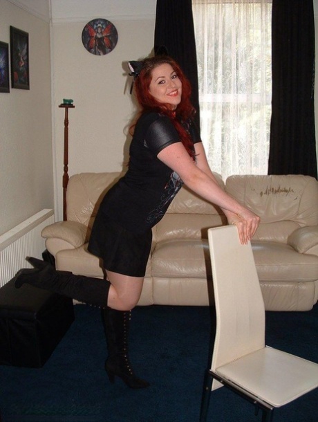 Thick redhead is tied to a chair with tape affixed to her mouth 17774739