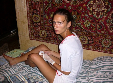 Amateur chick Dasi West poses non nude in a naughty nurse outfit on a bed 12098861