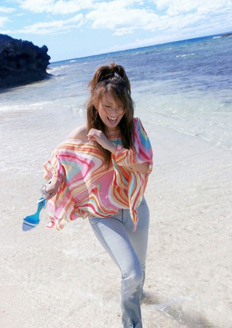 Japanese teen Nao Yoshizaki exposes her tits and bush on her way to the beach 74841175