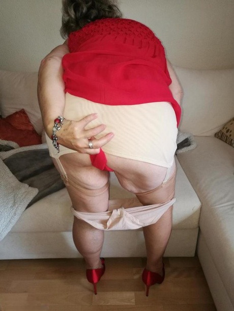 Horny oma Caro hikes up long red dress to spread her hairy vagina 54145450