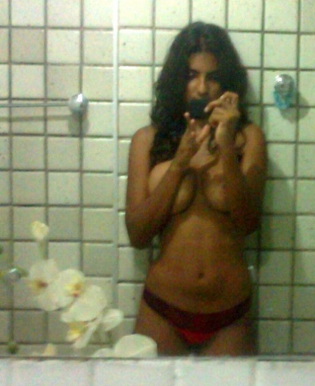 Indian girl takes selfies in a bathroom after unveiling her nice tits 47950573