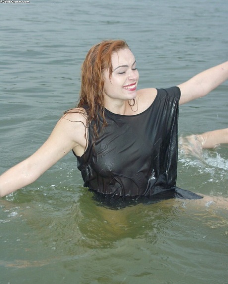 Teen girls partially remove wet clothing after wading into a river 53465850