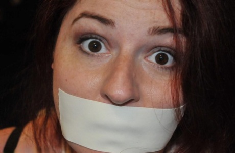 White girl is silenced with medical tape while tied up in her clothing 56865189