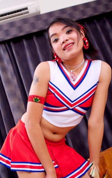 Tiny Asian cheerleader Mini licks a penis with a pierced tongue in cute undies 98427578