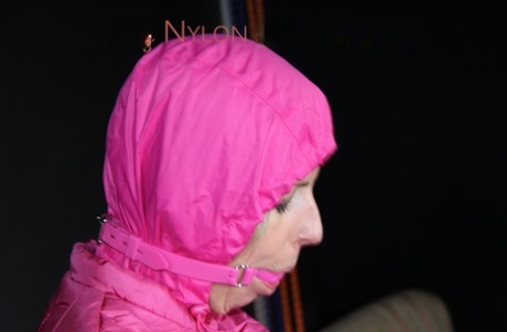 Blonde girl is restrained and gagged by her lesbian lover in pink nylon attire 39676113