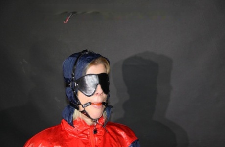 Blonde girl is tied up while ball gagged and blindfolded in nylon clothing 78907202
