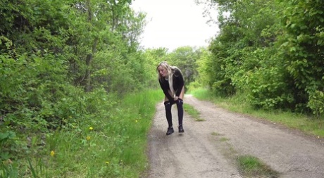 Blonde girl Victoria Pure squats for a piss on a country lane 14040219
