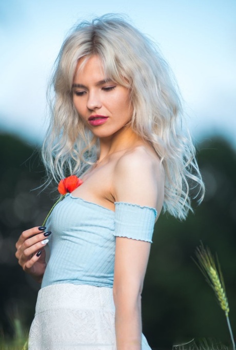 Platinum blonde teen Zarina A gets naked while in a hay field 50946346