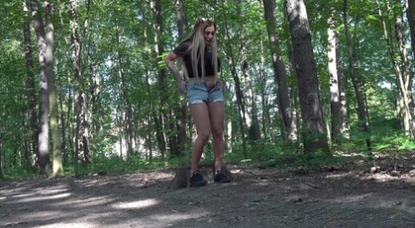 Short taken girl Daisy Lee pees upon a stump while out in the woods 67455109