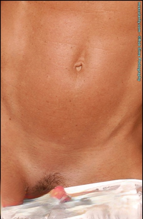 Blonde bodybuilder Dena Anne removes white lingerie in a sensual manner 91409989