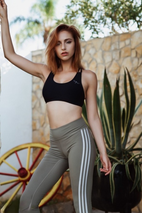 British redhead Sophia Blake removes athletic wear to stand naked outdoors 37336005