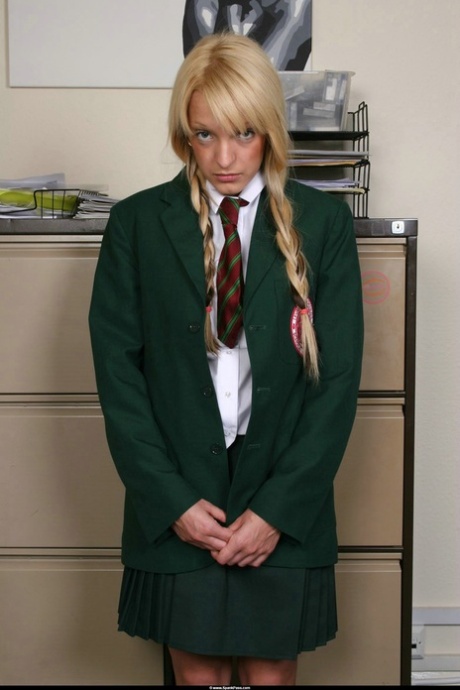 Blonde student exposes her bum for a caning from her female teacher 98331085