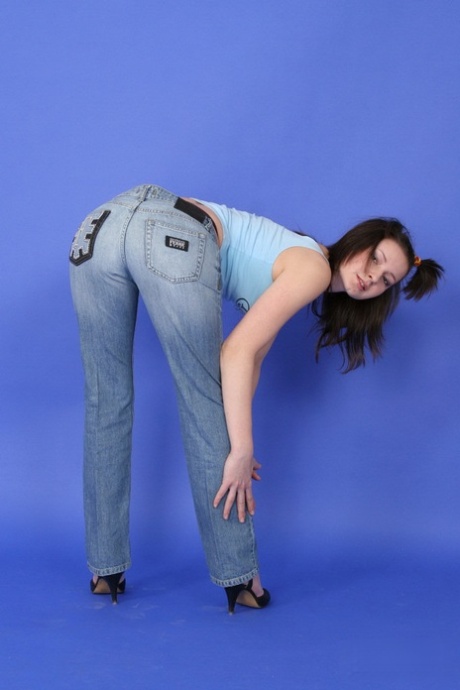 Brunette teen discards a tank top and jeans to pose in her underthings 67022709