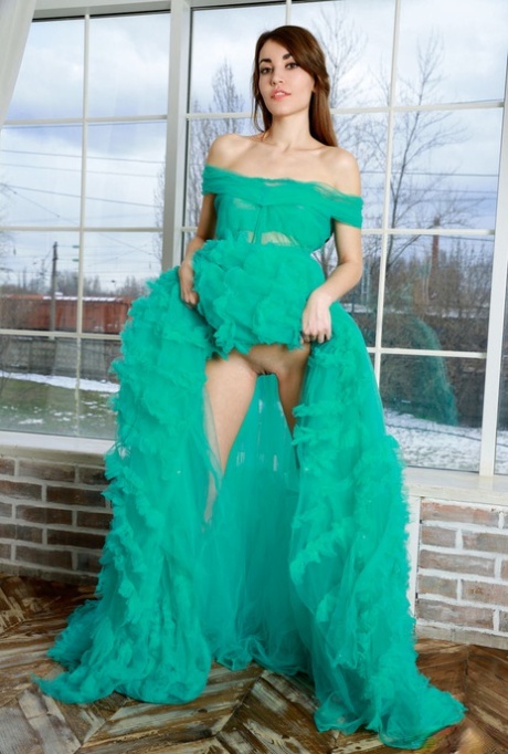 Nice teen Rosie Lauren removes an elegant gown to model in the nude 74012360