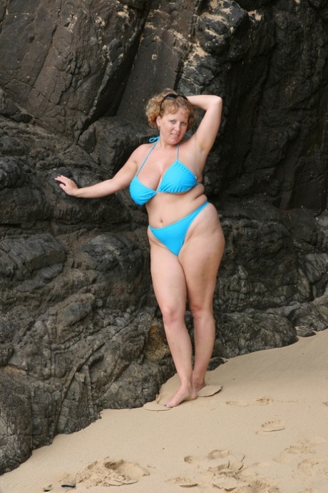 Thick British woman Curvy Claire looses her boobs from her bikini by the sea 75149284