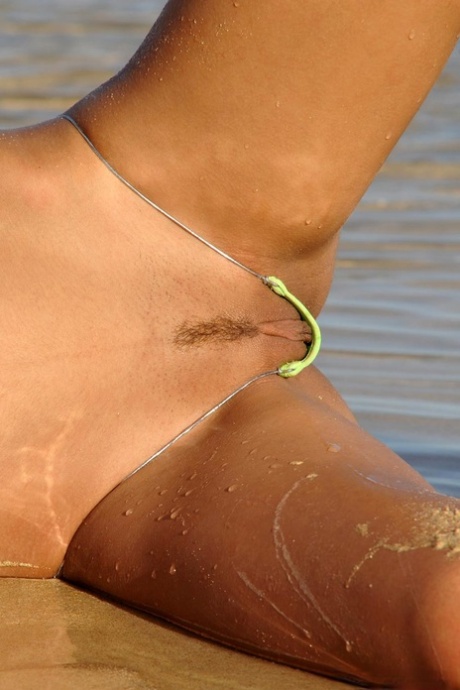 Pretty brunette does away with her bikini to get naked in the ocean 87258616