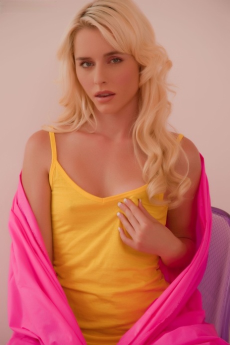 Blond chick with a hot face plays with her pussy as a breast escapes her shirt 71975101