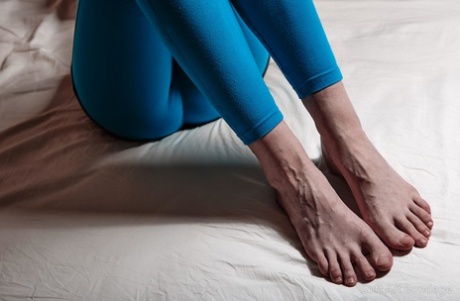Clothed female has her tights pulled down while tied up on a bed with rope 43279829
