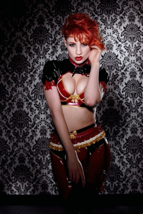 Natural redhead Ulorin Vex removes latex clothing in a garter belt and boots 36289825
