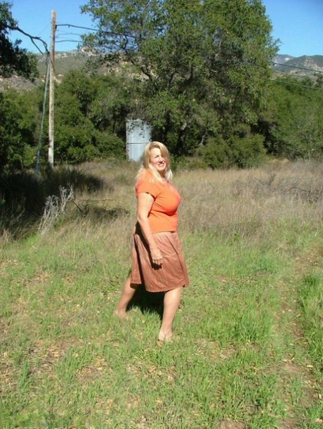 Old amateur Adonna bares her big tits and bald cunt with the sun in her eyes 45873377