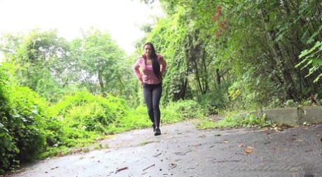 Pretty brunette Isabel Dark pulls down her pants to pee on a paved path 75283047