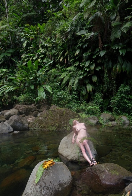 Glamour model Sloane Vdc poses for a nude shoot while in a stream 31705979