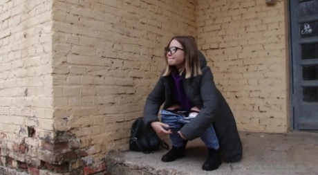 Nice girl Lera takes a badly needed pee on the porch of a building 22552651