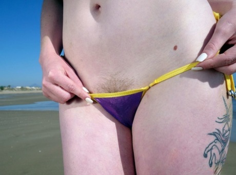 Solo girl Carly Rae shows pubic hairs while modelling a bikini at low tide 49426778