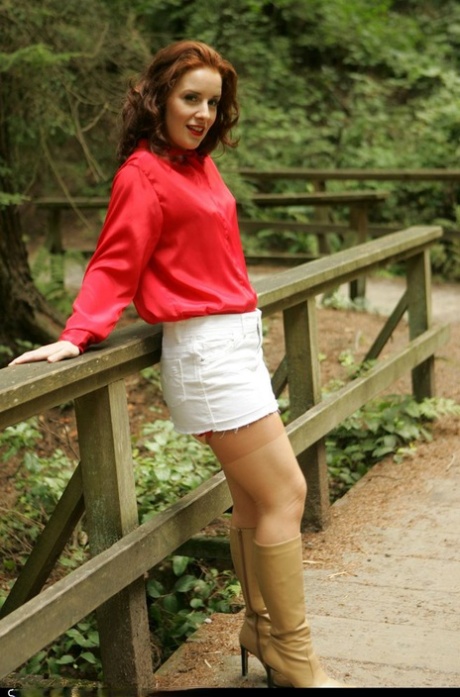Redhead amateur Nylon Angie exposes herself on a public path in nylons & boots 31295754