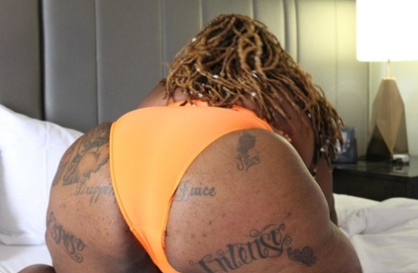 Obese ebony amateur Atl Sexual Savage bares her tattooed body on a bed 74404520