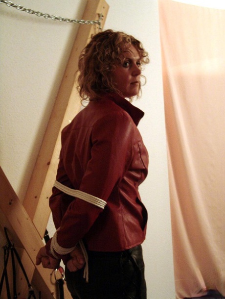 Clothed woman Blonde Lea sports curly hair while being tied up & cleave gagged 86716239
